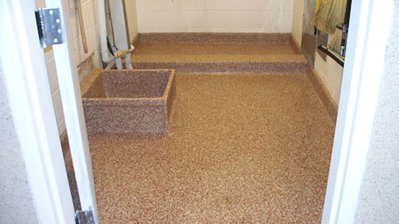 Red JetRock epoxy flooring applied to the floor of a maintenance room