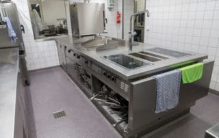 A commercial kitchen with epoxy flooring installed