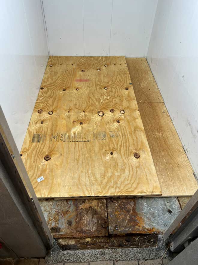 Pre-sealed plywood layer inside a walk-in cooler